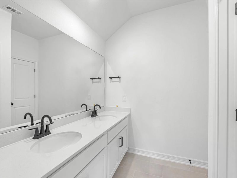 Secondary bathroom. Sample product photo. Actual exterior and interior selections may vary by homesite. Photo may be virtually staged.