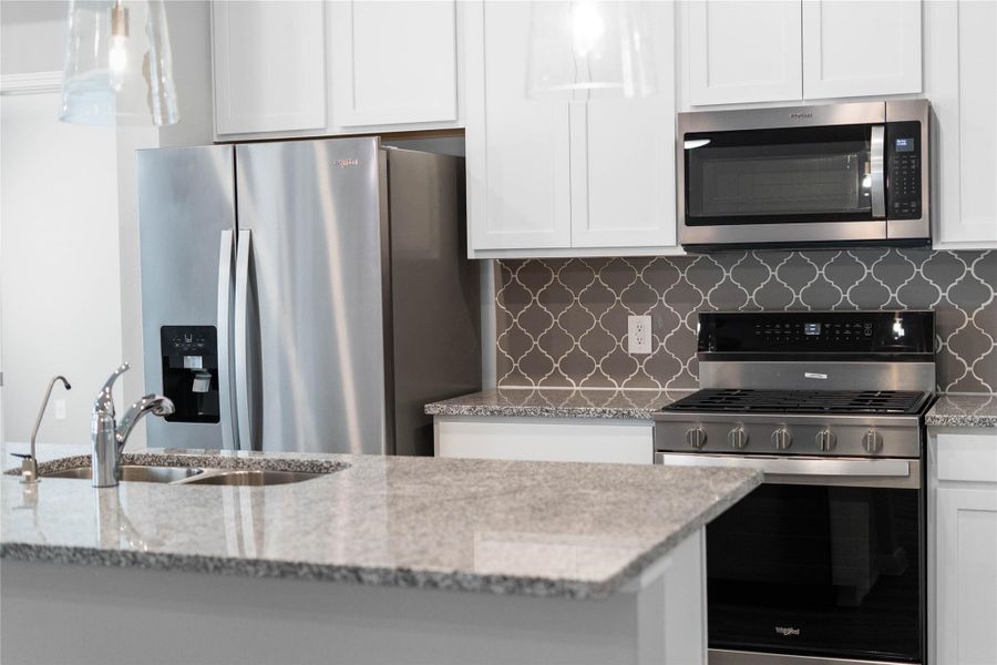 This gorgeous kitchen is an entertainer’s dream, featuring an oversized island, premium finishes, and abundant storage. Designed as the home's ultimate social hub, it offers the perfect balance of open-concept beauty and functional workspace. This gorgeous kitchen is an entertainer’s dream, featuring an oversized island, premium finishes, and abundant storage. Designed as the home's ultimate social hub, it offers the perfect balance of open-concept beauty and functional workspace.