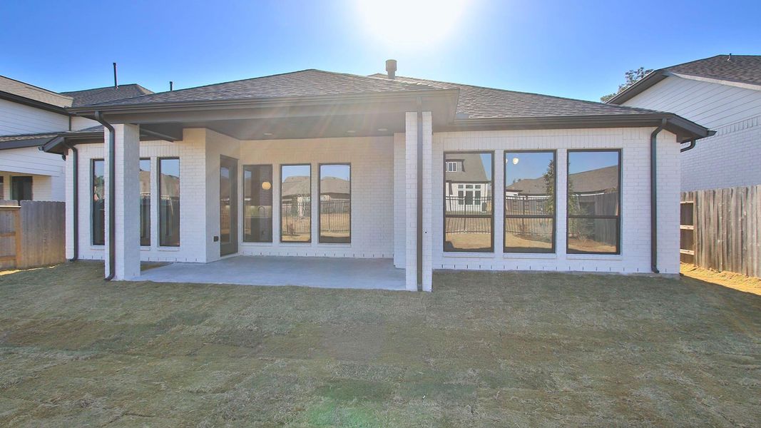 Exterior details and patio area of a home in Artavia, Conroe (Image 3).