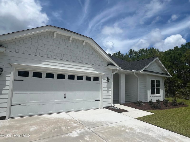 Front exterior of a new home in Rutledge, Shallotte, NC, highlighting curb appeal (Image 2).