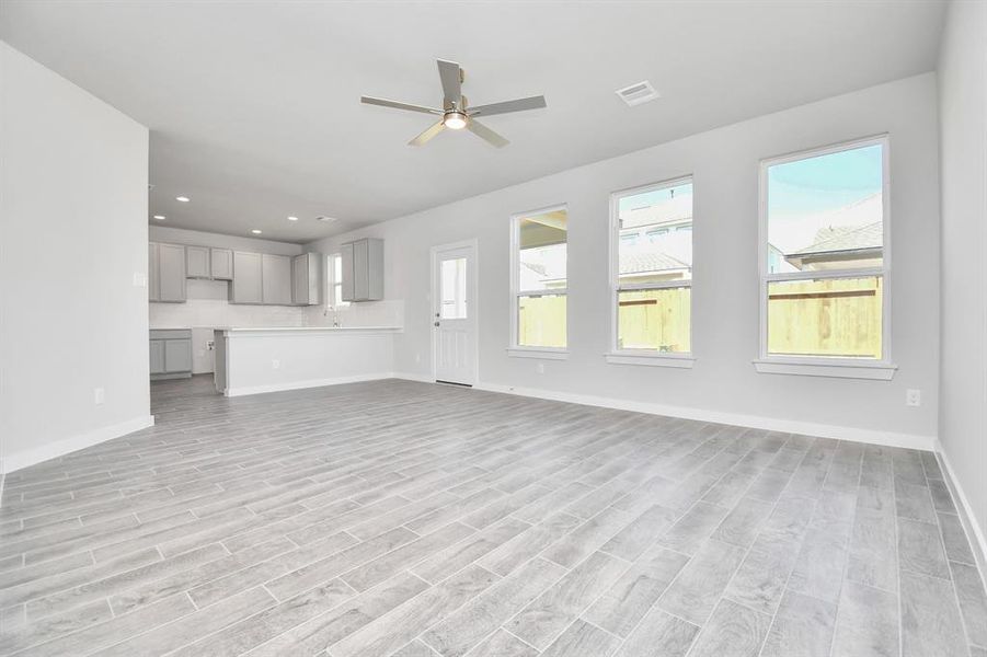 Another view of the family room. Sample photo of completed home with similar floor plan. As-built interior colors and selections may vary.