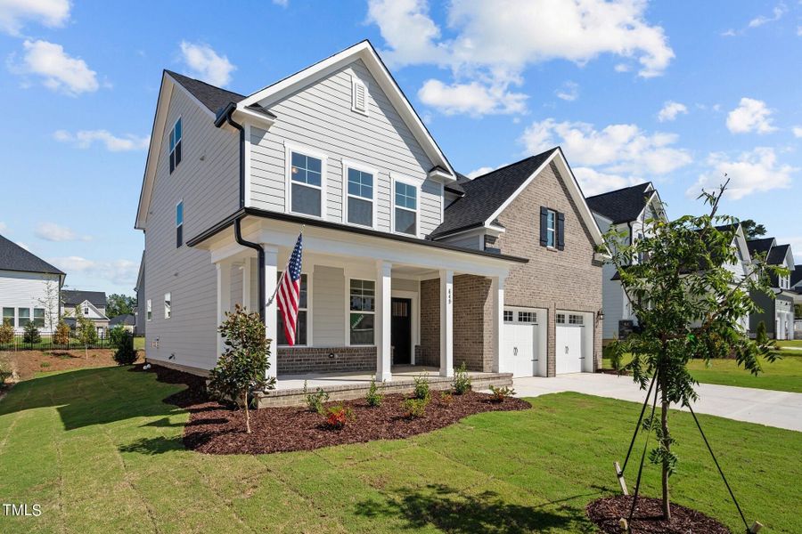 Front exterior of a new home in Glenmere, Knightdale, NC, highlighting curb appeal (Image 119). Front exterior of a new home in Glenmere, Knightdale, NC, highlighting curb appeal (Image 119).