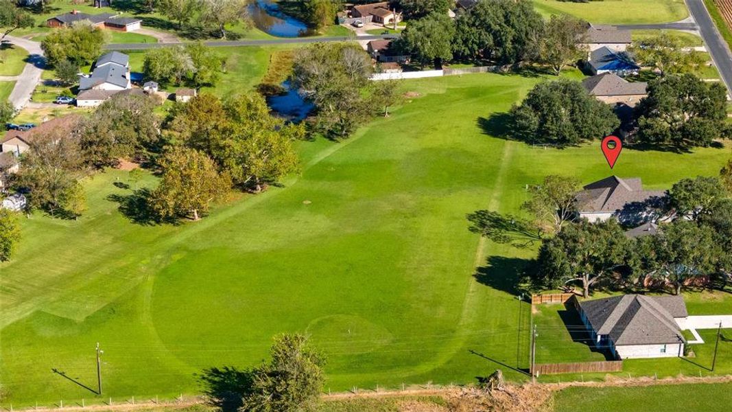 This aerial view of a portion of the community reflects the large amount of green space directly behind the home.