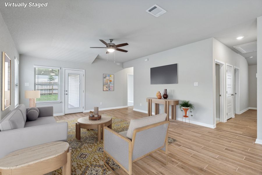 Virtually staged living room in the Allen floorplan at a Meritage Homes community. Virtually staged living room in the Allen floorplan at a Meritage Homes community.