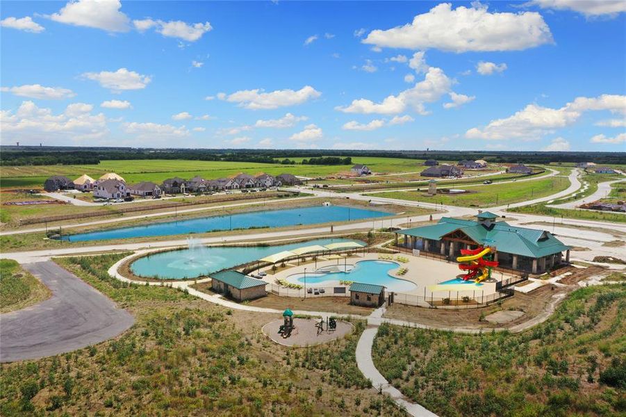 Community recreation center featuring multiple swimming pools, waterslides, and a separate playground