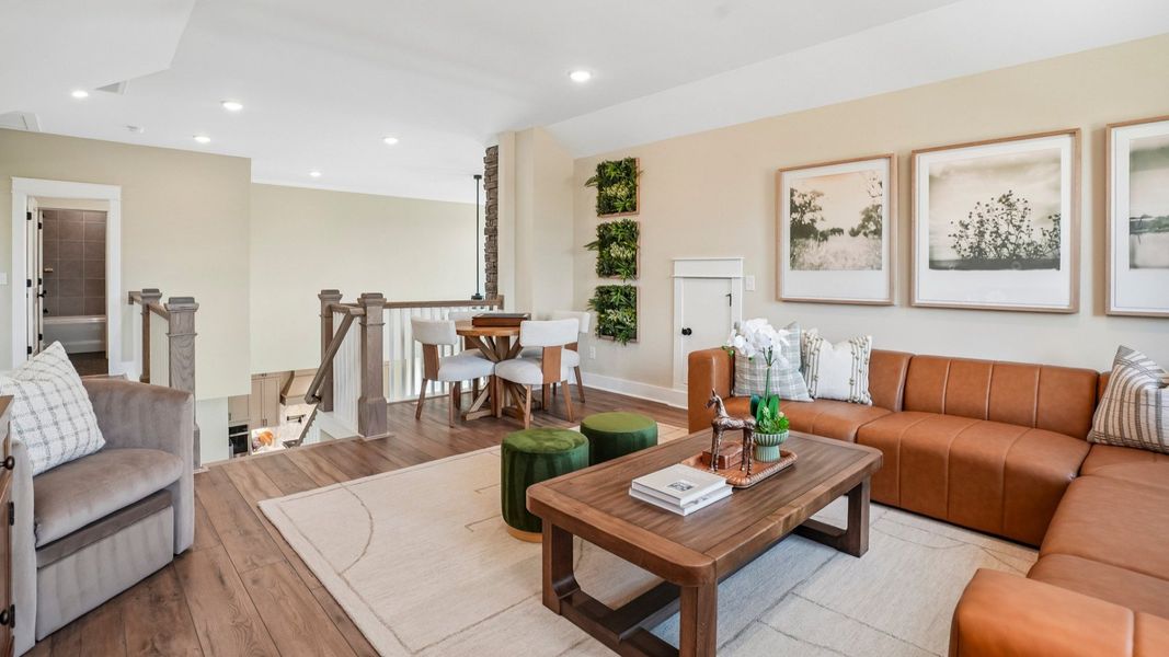 Spacious loft area with access to staircase and walkway to bedrooms Spacious loft area with access to staircase and walkway to bedrooms