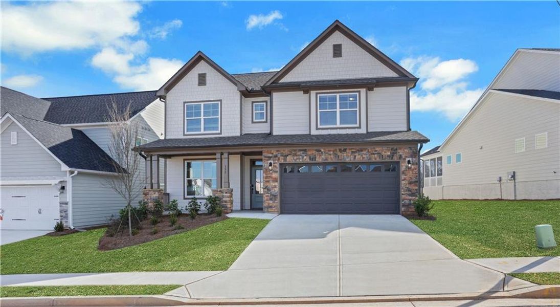 Front exterior of a new home in Twin Lakes, Hoschton, GA, highlighting curb appeal (Image 22).