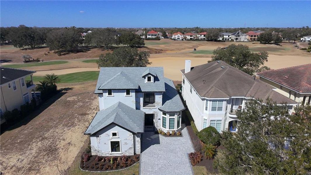 Front exterior of a new home in , Reunion, FL, highlighting curb appeal (Image 26).