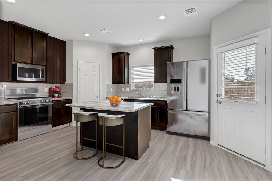 Representative furnished interior of a home built from the Floor Plan 1243 by Colina Homes in River Ranch, Dayton (Image 8).