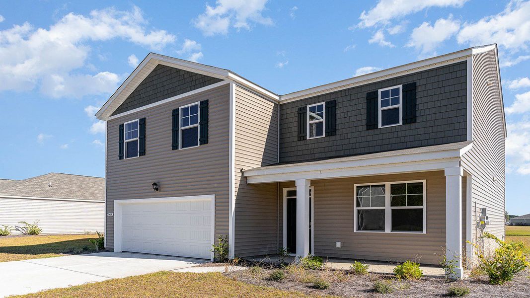 Front exterior of a new home in Lochaven, Conway, SC, highlighting curb appeal (Image 2). Front exterior of a new home in Lochaven, Conway, SC, highlighting curb appeal (Image 2).