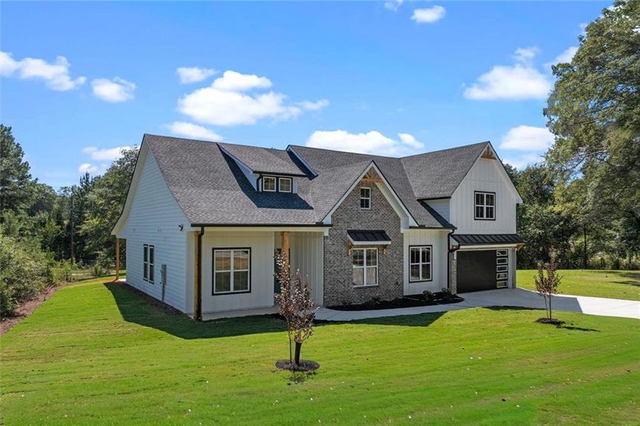 Front exterior of a new home in , Powder Springs, GA, highlighting curb appeal (Image 31).