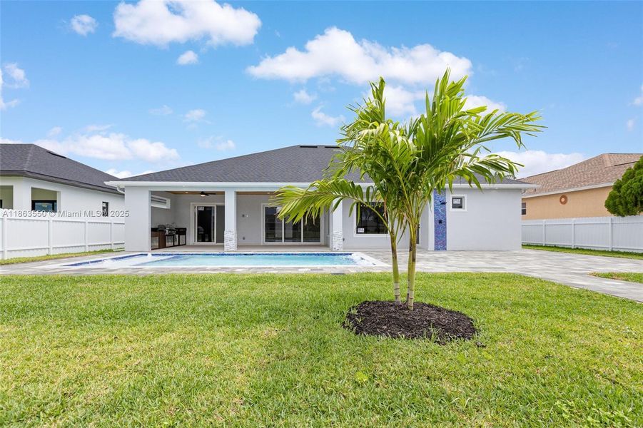 Front exterior of a new home in , Cape Coral, FL, highlighting curb appeal (Image 33). Front exterior of a new home in , Cape Coral, FL, highlighting curb appeal (Image 33).