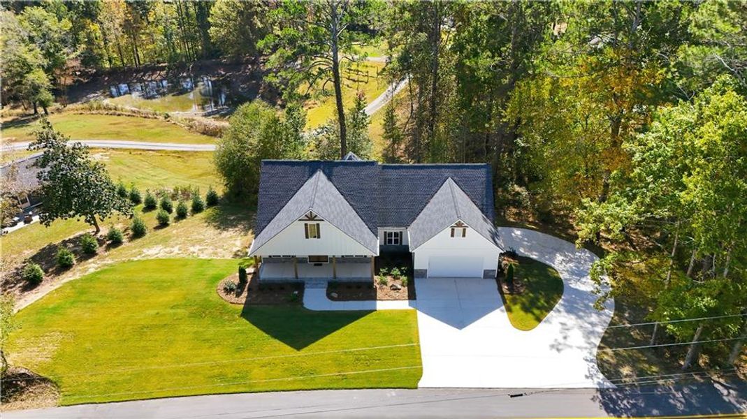 Front exterior of a new home in , Dallas, GA, highlighting curb appeal (Image 27).