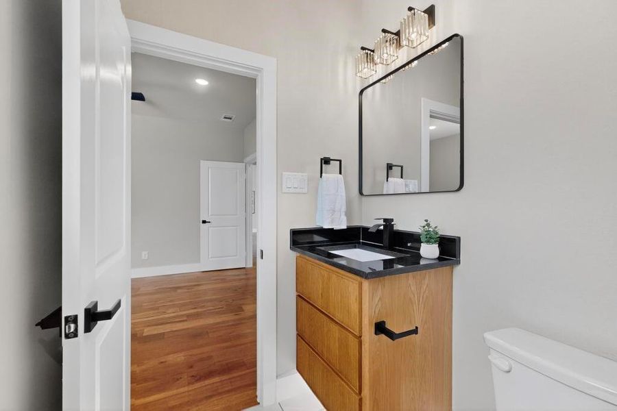 Bathroom with vanity and wood finished floors