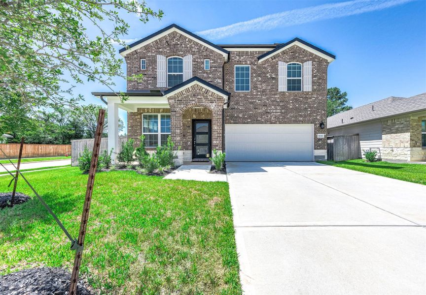 Front exterior of a new home in Magnolia Place, Magnolia, TX, highlighting curb appeal (Image 1). Front exterior of a new home in Magnolia Place, Magnolia, TX, highlighting curb appeal (Image 1).