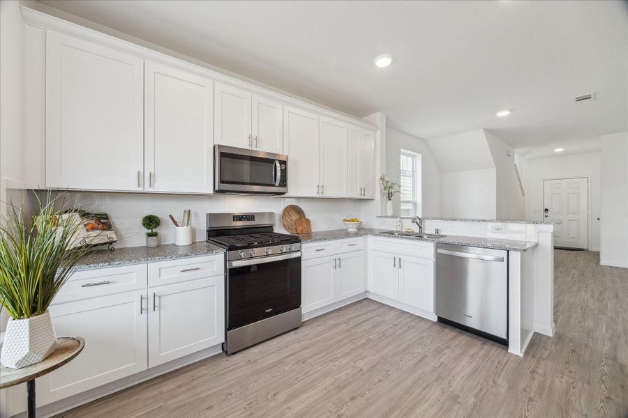 Furnished interior view inside a new home in Decker Farms, Magnolia (Image 14).