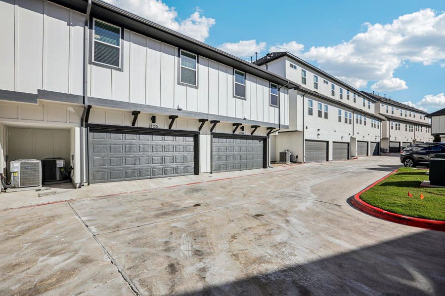 Front exterior of a new home in Koenig Townhomes, Austin, TX, highlighting curb appeal (Image 26).