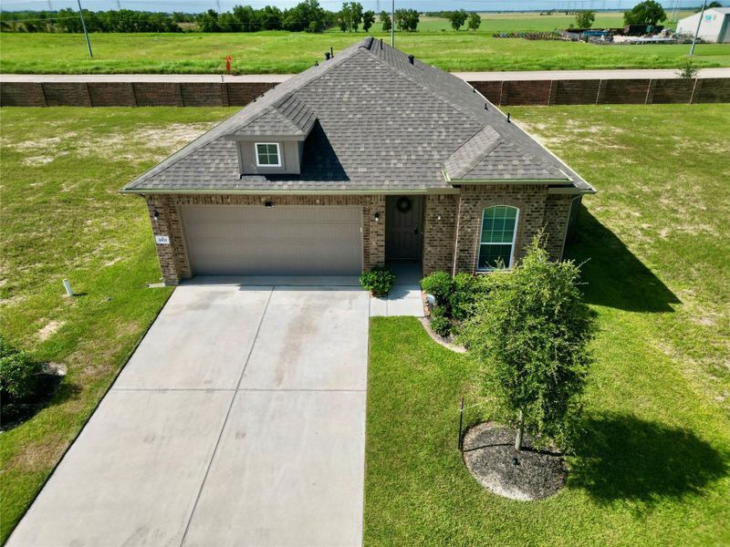 Front exterior of a new home in , Angleton, TX, highlighting curb appeal (Image 26).