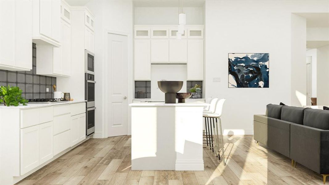 Kitchen featuring backsplash, light wood-type flooring, and white cabinetry