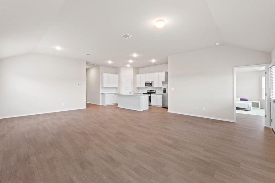 Beautiful vinyl plank flooring runs through the entire living, kitchen, and dining area, making daily cleanup completely stress-free Beautiful vinyl plank flooring runs through the entire living, kitchen, and dining area, making daily cleanup completely stress-free