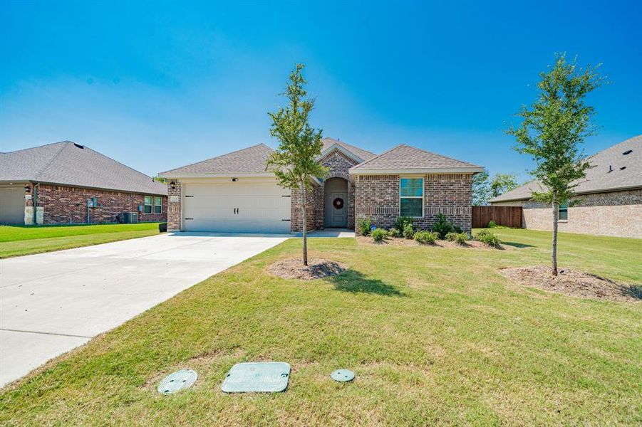 Front exterior of a new home in , Kaufman, TX, highlighting curb appeal (Image 20). Front exterior of a new home in , Kaufman, TX, highlighting curb appeal (Image 20).