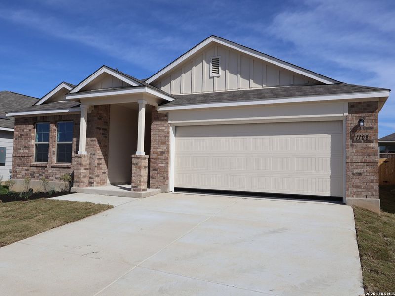 Front exterior of a new home in Greenspoint Heights, Seguin, TX, highlighting curb appeal (Image 20).