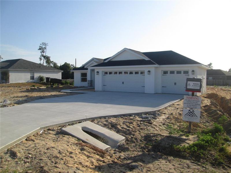 Front exterior of a new home in , Ocala, FL, highlighting curb appeal (Image 31).