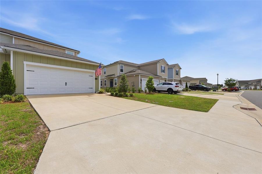 Front exterior of a new home in , Palm Coast, FL, highlighting curb appeal (Image 27).