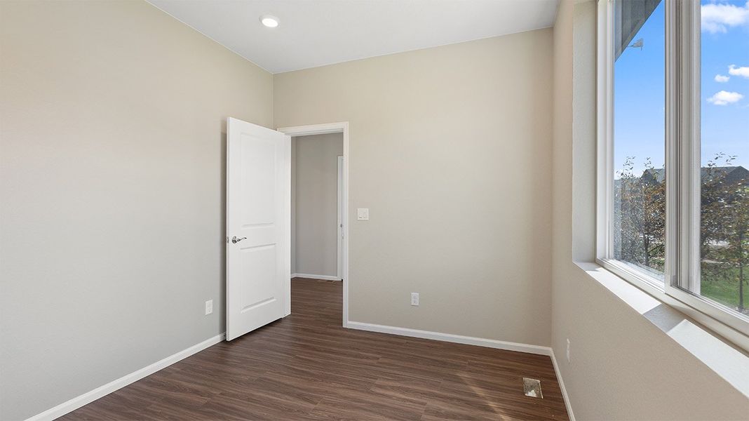 Spacious, unfurnished interior of a new home in Woodrose at Painted Prairie, Aurora (Image 10).