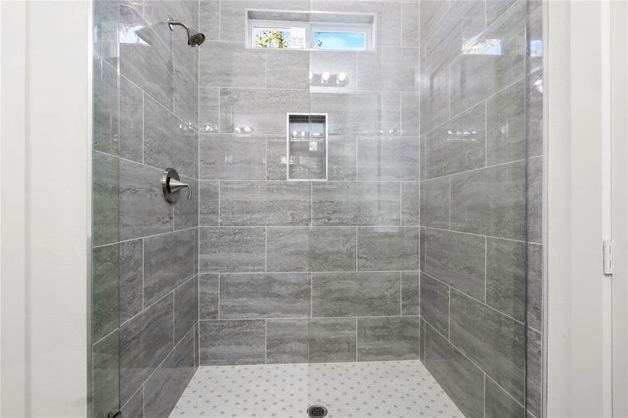 Bathroom with tiled shower