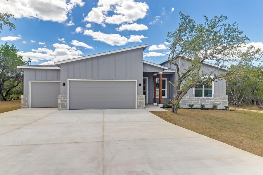 Front exterior of a new home in Lago Vista, Lago Vista, TX, highlighting curb appeal (Image 1). Front exterior of a new home in Lago Vista, Lago Vista, TX, highlighting curb appeal (Image 1).