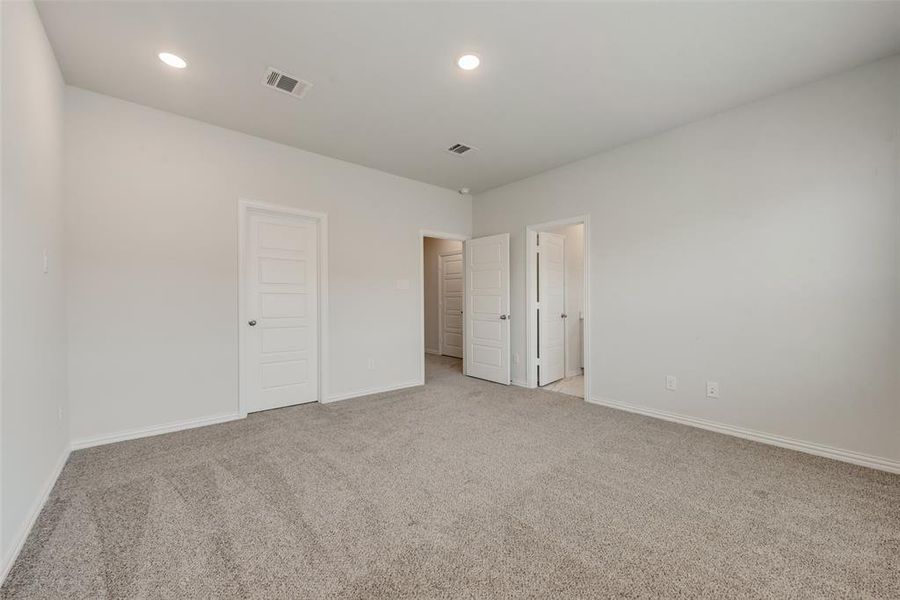 Unfurnished bedroom featuring light carpet