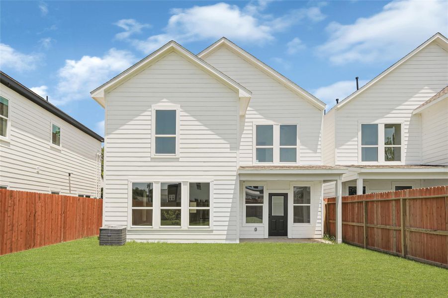 Fenced backyard with covered patio and outdoor living potential. Fenced backyard with covered patio and outdoor living potential.
