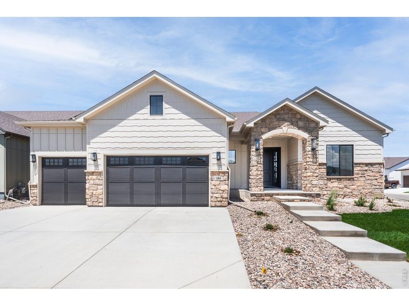 Front exterior of a new home in Greenspire At Windsor Lake, Windsor, CO, highlighting curb appeal (Image 25).