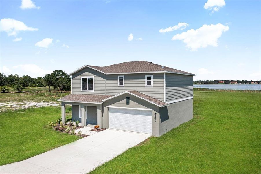 Front exterior of a new home in Scenic Terrace, Haines City, FL, highlighting curb appeal (Image 10).