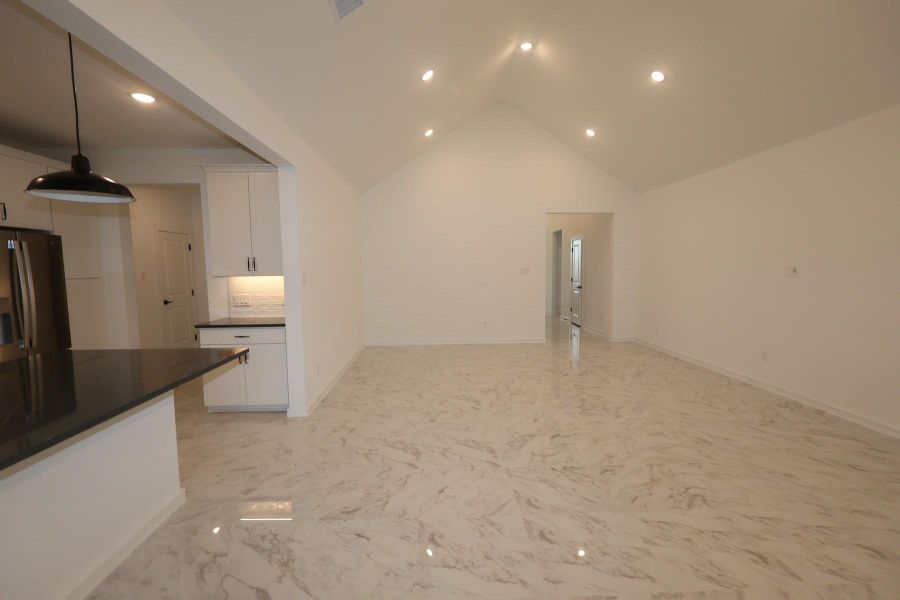 Impressive great room and dining area with vaulted ceilings