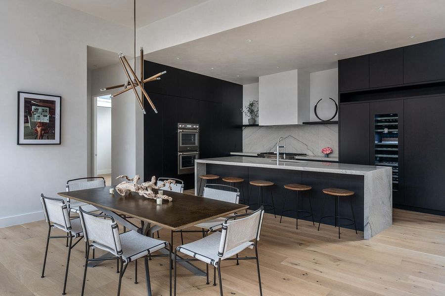 An open-concept living space integrates a sophisticated kitchen and a refined dining area. An open-concept living space integrates a sophisticated kitchen and a refined dining area.