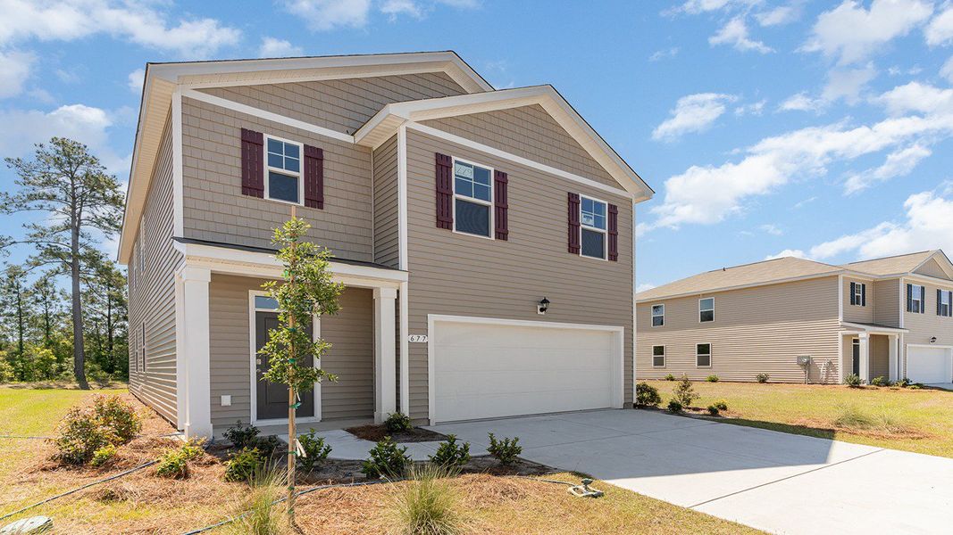 Representative exterior photo of a completed home built from the ROBIE by D.R. Horton in Sandridge Park, Little River, SC (Image 15).