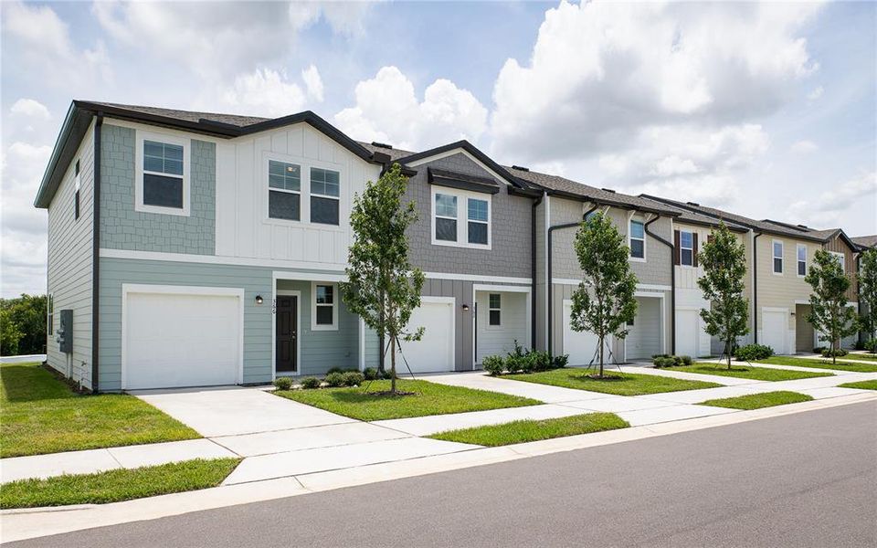 Front exterior of a new home in Temples Crossing, Davenport, FL, highlighting curb appeal (Image 24).