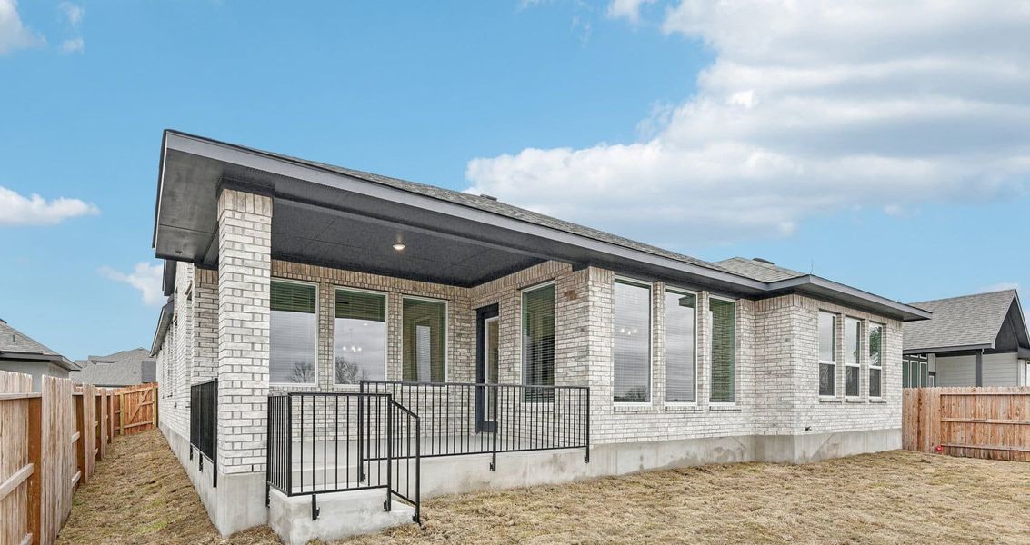 Exterior details and patio area of a home in Village at Three Oaks, Seguin (Image 4). Exterior details and patio area of a home in Village at Three Oaks, Seguin (Image 4).