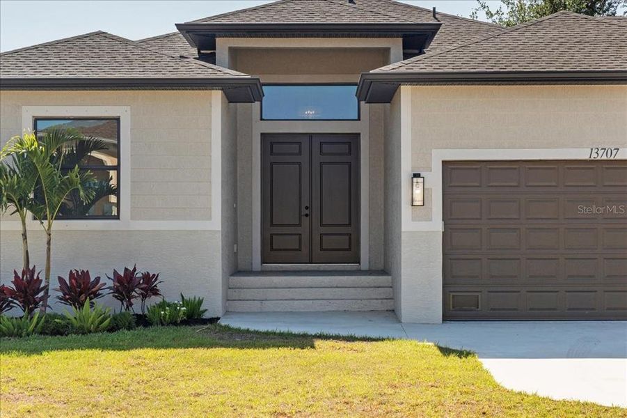 Front exterior of a new home in , Port Charlotte, FL, highlighting curb appeal (Image 2).