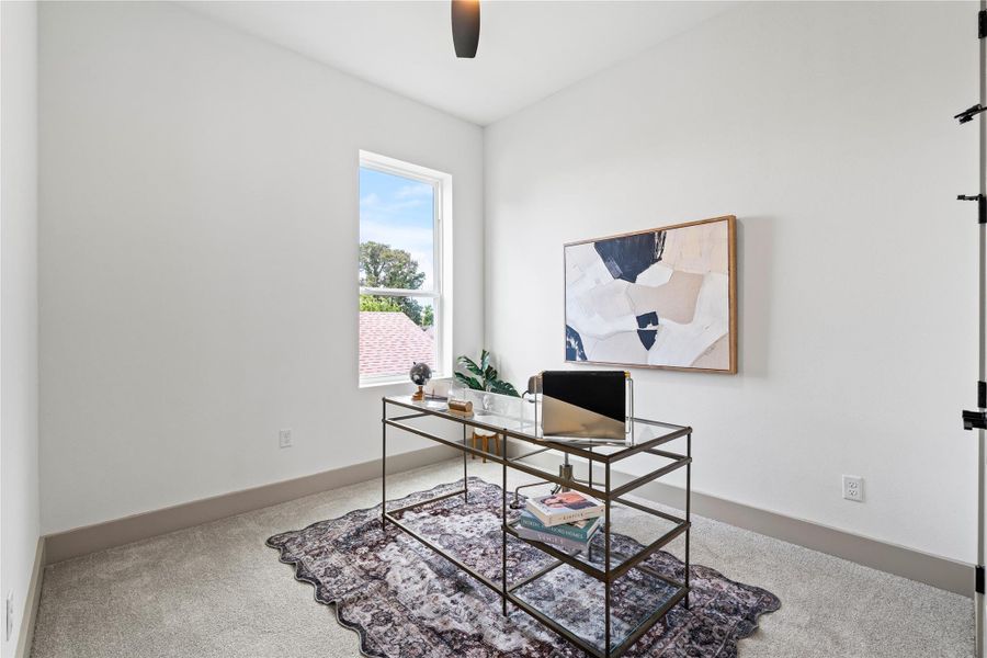 Whether you’re taking meetings or finding a moment of focus, this light-filled flex space offers the perfect setup for a home office, reading nook, or creative retreat—complete with plush carpet, modern trim, and serene window views. Whether you’re taking meetings or finding a moment of focus, this light-filled flex space offers the perfect setup for a home office, reading nook, or creative retreat—complete with plush carpet, modern trim, and serene window views.