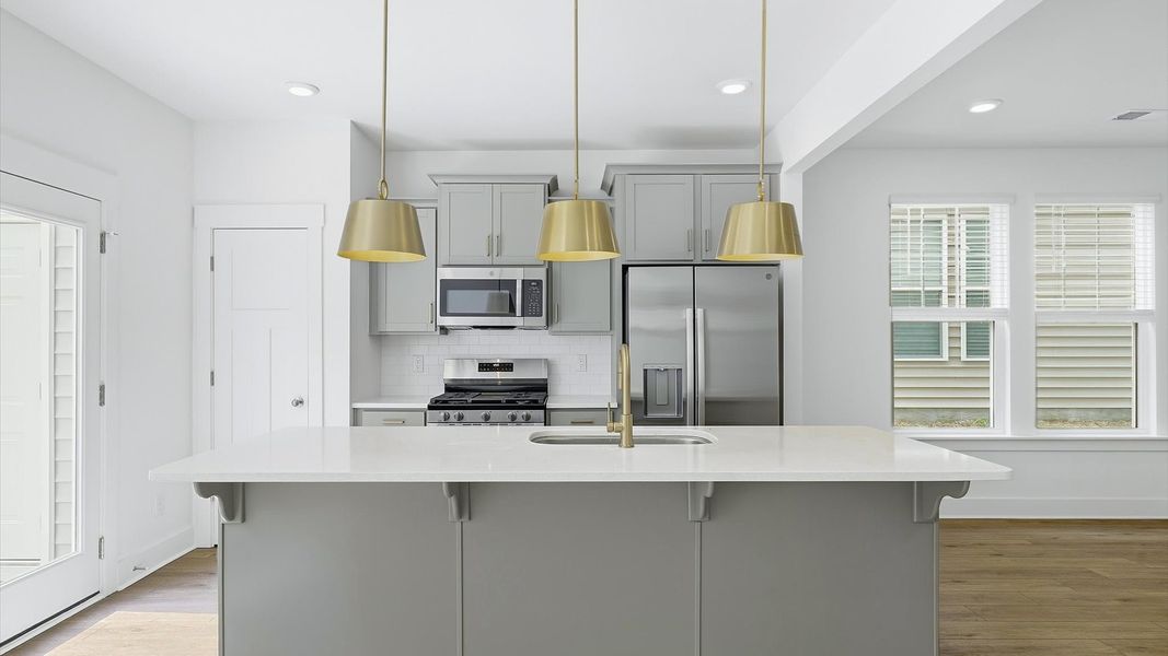 First-class finishes and a thoughtfully scaled island highlight this elegant kitchen space at El Dorado First-class finishes and a thoughtfully scaled island highlight this elegant kitchen space at El Dorado