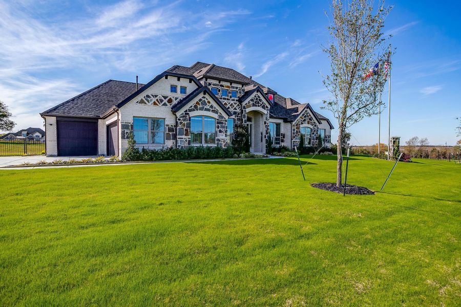 Front exterior of a new home in Heritage, McLendon-Chisholm, TX, highlighting curb appeal (Image 20).