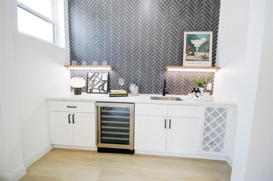 Full functional wet bar just off of the living room. Only home in the area with plumbing in their bar area already installed and ready to go!