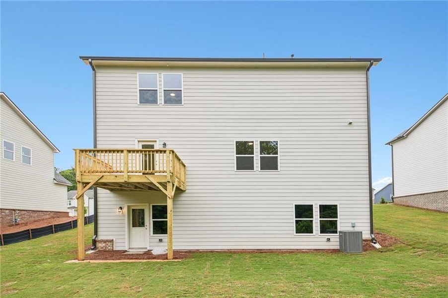 Exterior details and patio area of a home in The Pointe at Heron Bay, Locust Grove (Image 4).