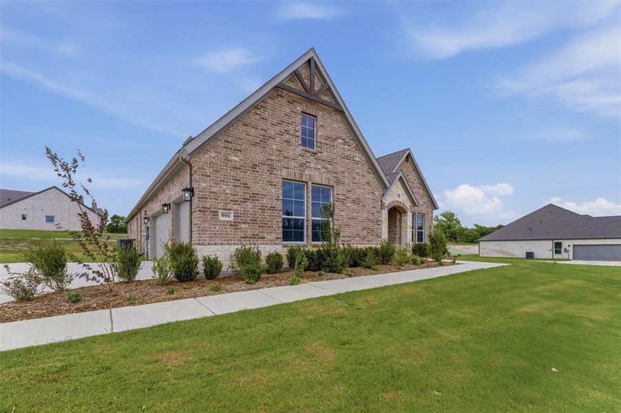 Front exterior of a new home in Grayson Ridge, Van Alstyne, TX, highlighting curb appeal (Image 19).
