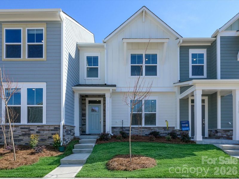Front exterior of a new home in North Creek Village, Huntersville, NC, highlighting curb appeal (Image 20).