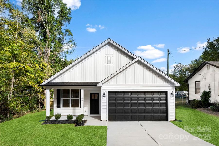 Front exterior of a new home in , Concord, NC, highlighting curb appeal (Image 15).