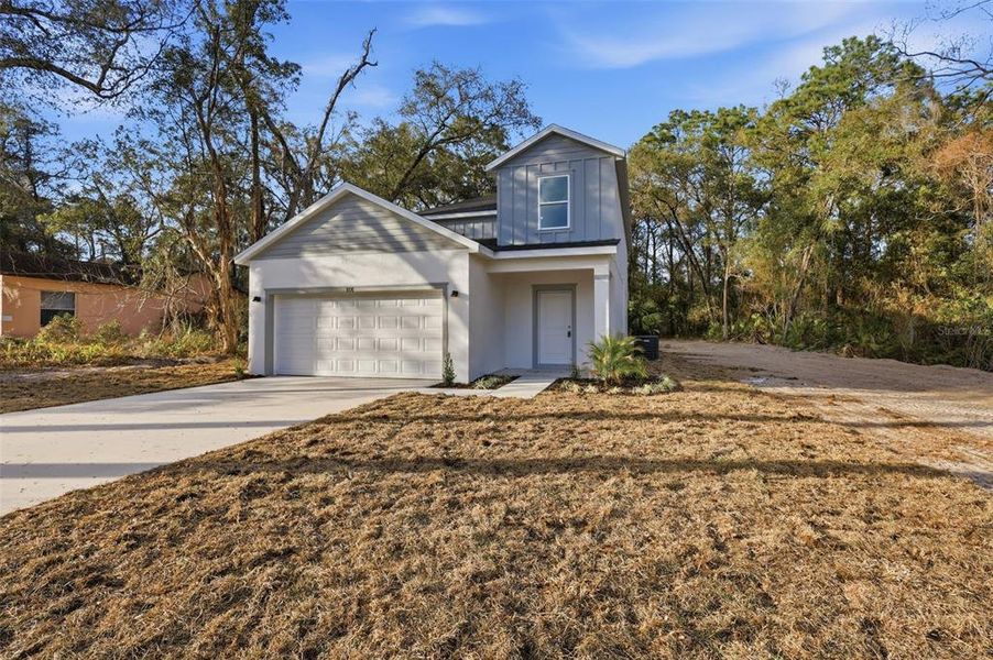 Front exterior of a new home in , Altamonte Springs, FL, highlighting curb appeal (Image 24).